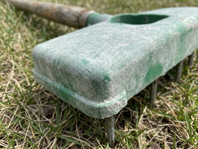 sun damage plastic lawn tool deterioration UV degradation chalking on plastic aerator base surface