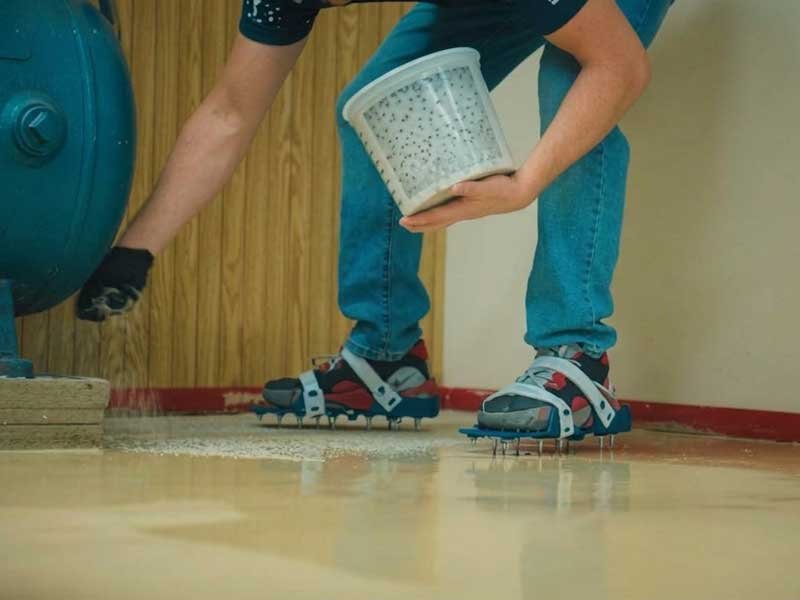 Spiked Shoes Walking on Wet Epoxy Floor Coating epoxy spiked shoes application on wet floor coating