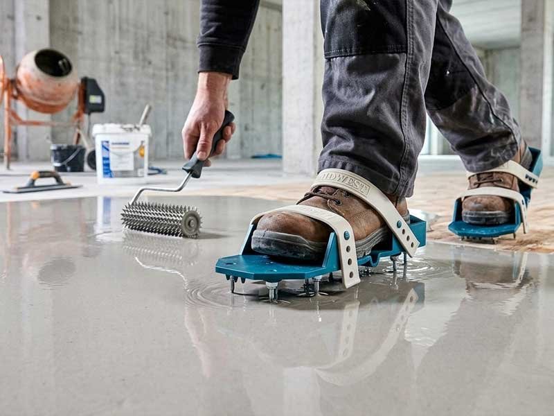 Adjustable Strap Spike Shoes Shared Tool Use Flooring Contractor adjustable strap PP spike shoes shared use on epoxy flooring job site